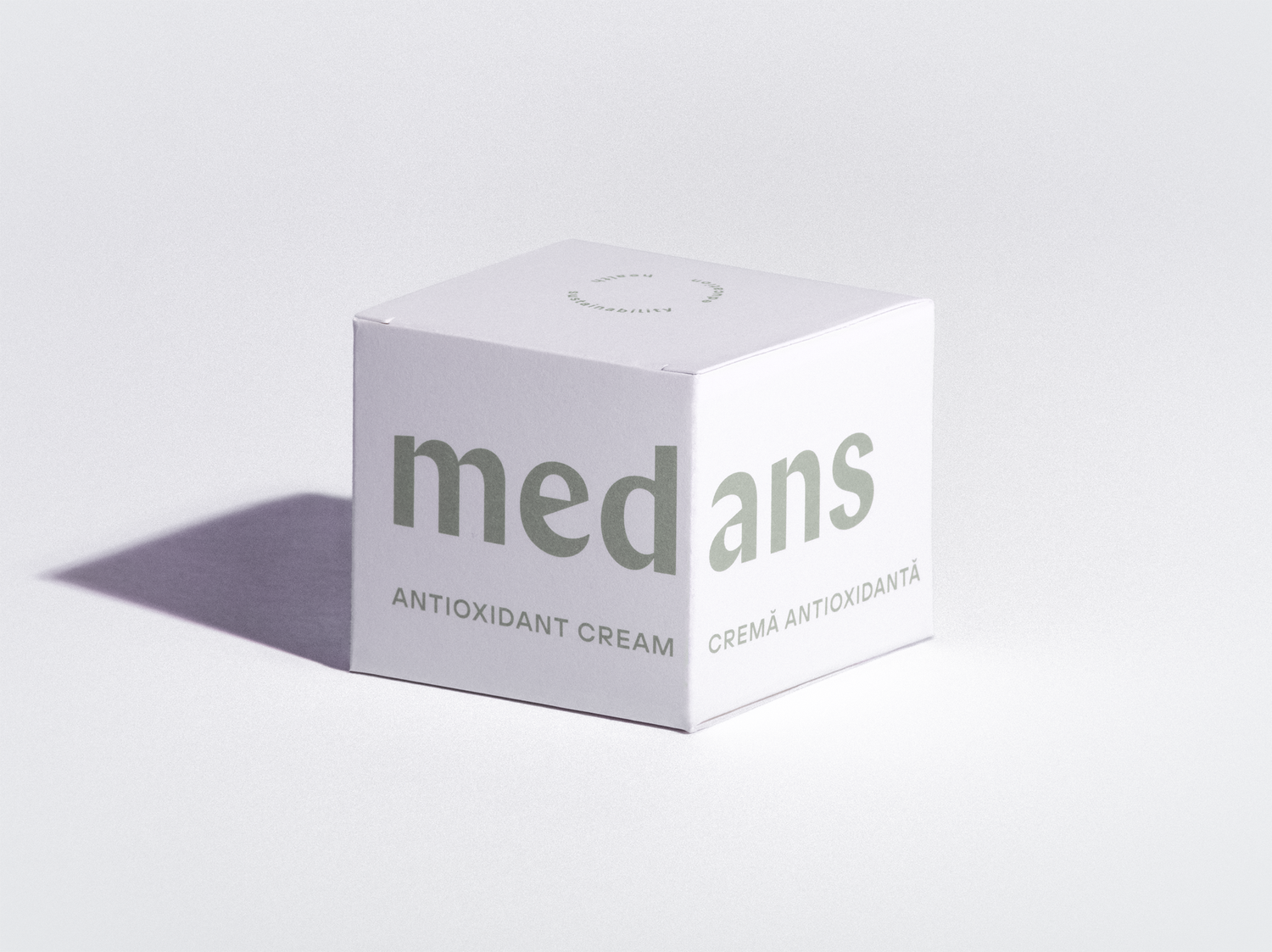 Box of medans antioxidant cream on a light gray background