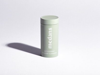 Green cylindrical medans container branding on a light gray background